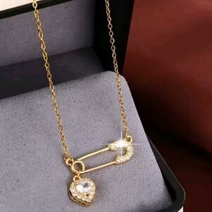 Elegant Gold Safety Pin Necklace with Heart Pendant